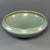 This elegant shallow‑form vessel features classic Longquan celadon glaze with soft mint‑green tone. Subtle carved ribbed...