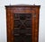 This elegant antique glazed corner cabinet is a fine example of Georgian-style craftsmanship, featuring a beautifully...