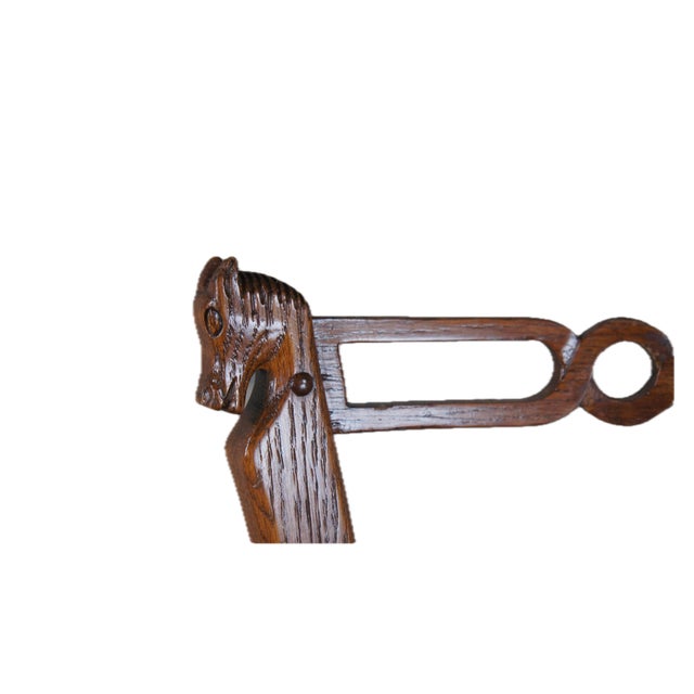 Three rare vintage Romweber Attributed Viking Oak bar stools. Made of oak featuring tapered form with horse head accents...