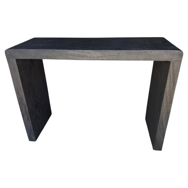 Minimalist console table made from suar wood with an impressive three inch thick top and legs. Charred sanded and sealed...