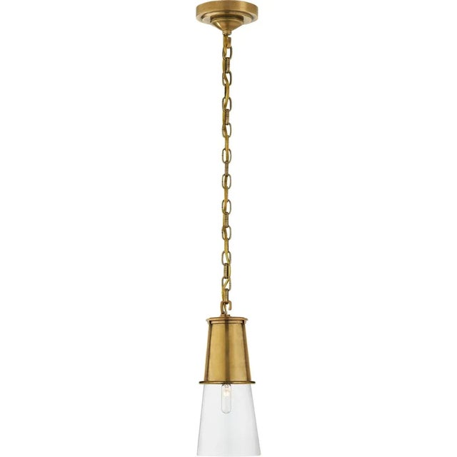 Robinson Small Pendant in Hand-Rubbed Antique Brass with Clear Glass Designer: Thomas O'Brien Canopy: 4.5" Round Mounting:...