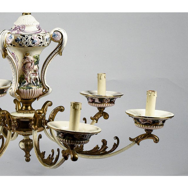 Colored and pierced painted porcelain chandelier capodimonte style production italy 1960. The chandelier is complete with...