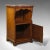 This is an antique nightstand. An English, walnut and marble, pot cupboard or bedside cabinet by Gillow & Co of Lancaster,...