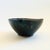 A hand made vintage studio pottery bowl. Finished in moody dark glazes with a purple interior and green exterior. Pinched...