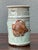 Celebrate the beauty of coastal-inspired craftsmanship with this vintage handcrafted ceramic vase, distinguished by its...