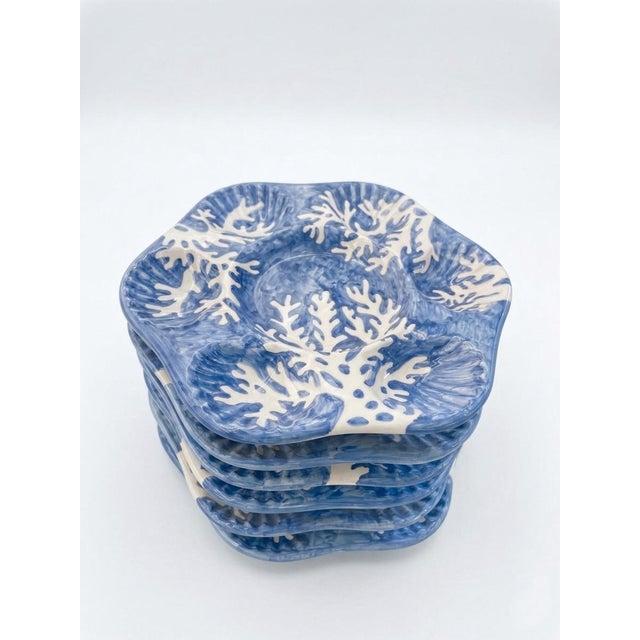 This exquisite set of six ceramic oyster plates is a premier example of Mediterranean artisan craftsmanship from the...