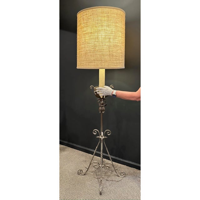 . Made in France, wrought iron, period unknown . Adjustable height . Hand turned scrolled . Hand hammered designed . Wax...