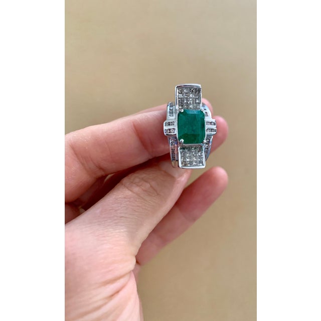 A classic, Cocktail ring Approximately 4 Carat Emerald and Diamond Ring, Estate Gold: 14 Karat white gold Weight: 11.68 gm...