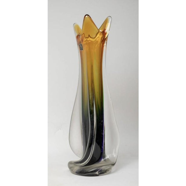 This tall art glass vase features a Martiglass label (often appearing as Multi Glass or Martei Glass). This is a key...