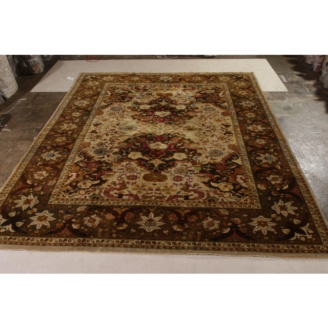 Hand-knotted in wool circa 1910-1920, this antique 10x13 rug is a rare Indian interpretation of Persian Shahrestan rugs—a...