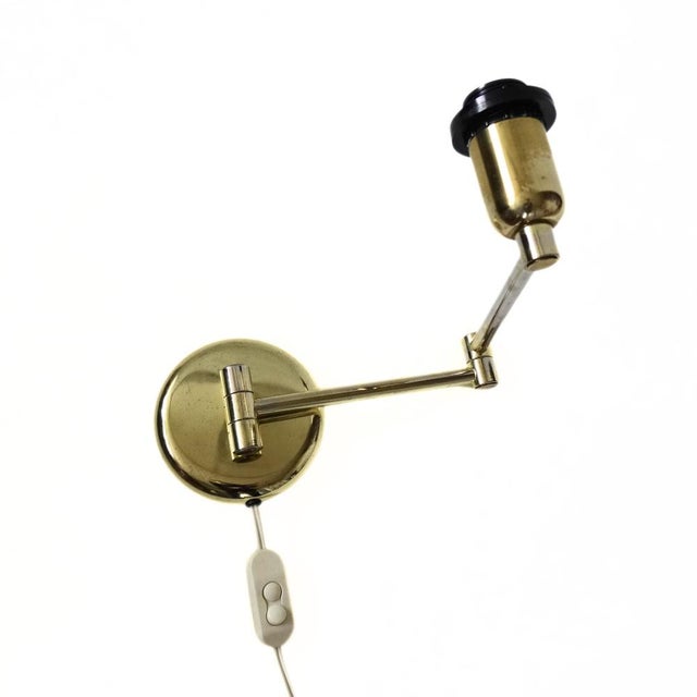 Vintage Brass Wall Light with foldable Arms. Designer unknown. Probably Sweden 1970s. Fully extended 42 cm. European Plug...