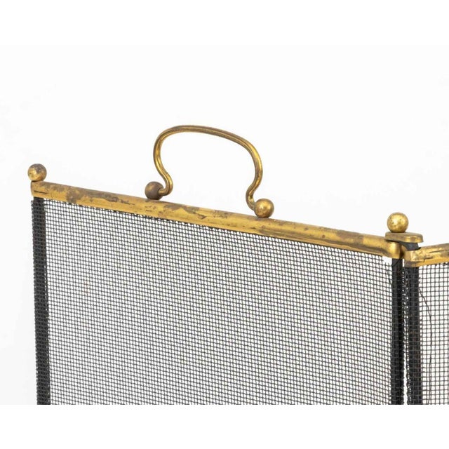Brass Framed Tri-Fold Fire Screen, the shorter panels surmounted by handles. Folded: 34" H x 26.5" W x 1" D. Provenance:...