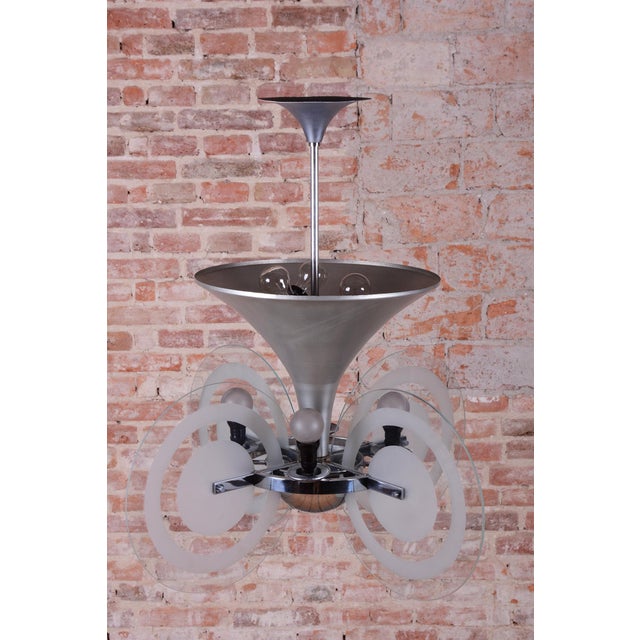 This exceptional chandelier is an authentic work by one of the most prominent Czech lighting designers, architect Franta...