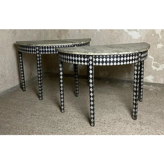 A wonderful pair of half moon side tables, English in origin and dating to the late Georgian period. Now painted in a...