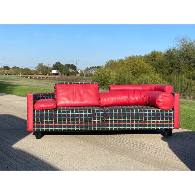 Postmodern Italian Molto + Di fun plaid upholstery with contrasting red leather sofa by Tittina Ammannati & Vitelli...
