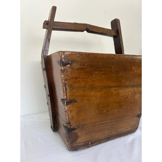 Amazing late 19th century Chinese grain or rice bucket. This rustic container is crafted most likely from solid Elm and...