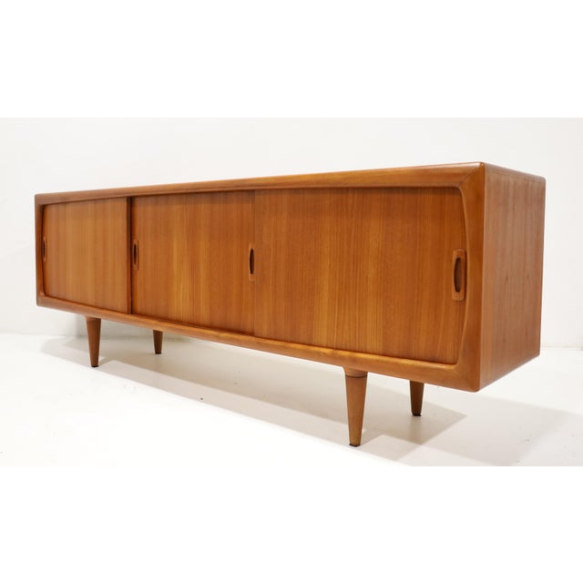 This is in great condition. A beautiful and functional sideboard or credenza made by H.P. Hansen, a premier Danish...