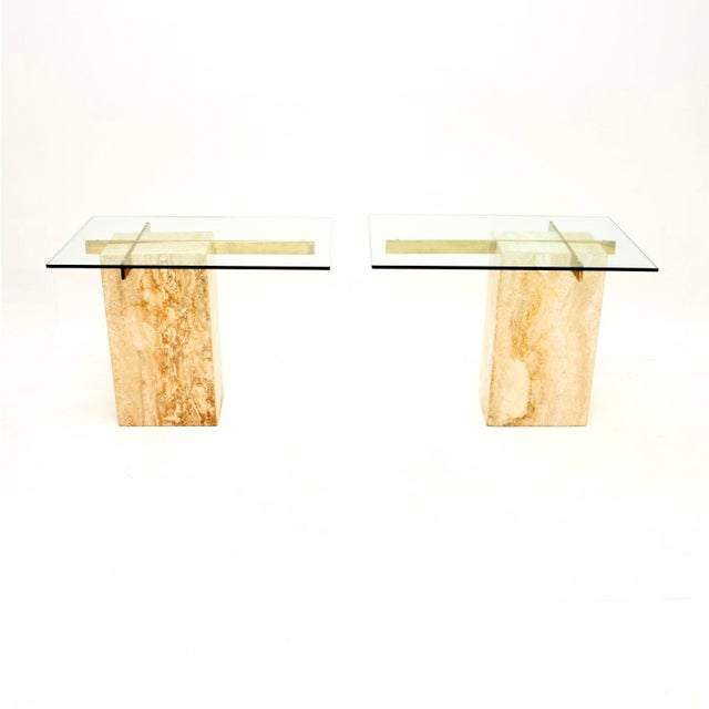 A stunning pair of vintage Italian travertine and brass side tables by Artedi. They were made in Italy, they date from the...