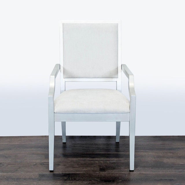 Set consists of 2 armchairs and 4 side chairs. The chairs are crafted from hardwood solids with walnut veneers in a shadow...