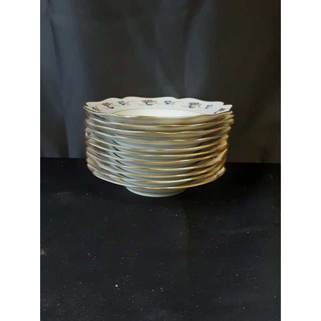 Vintage KPM Porcelain soup bowls with gold trim and blue and gold pattern.