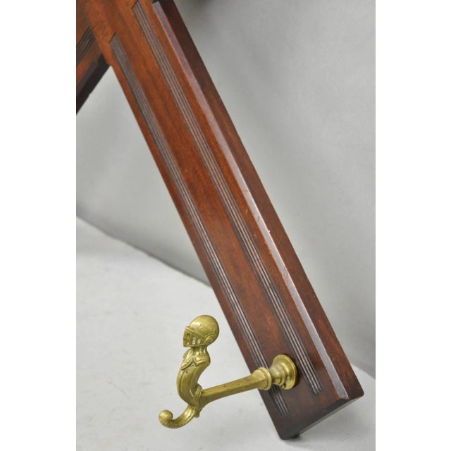 Antique Victorian Mahogany X-Form Wall Coat Rack W/ Brass Knight's Helmet Hooks For Sale - Image 4 of 14