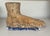 Oversized carved pine foot sculpture with gesso accents.