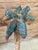 Bring a touch of Old Florida and island-inspired charm to any space with this striking pair of sculptural metal palm tree...