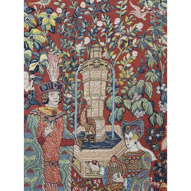 Important medieval-style wall tapestry depicting a courtly scene in a richly decorated garden, in the spirit of antique...