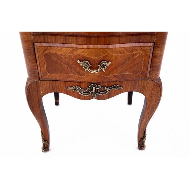 A small chest of drawers, a French-style chiffonier from the turn of the 19th and 20th centuries, is a charming piece of...
