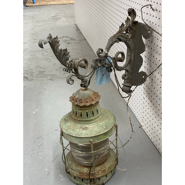 Large Antique Procter Port Style Lantern with an Elaborate Bracket. I believe this lantern would have been modified to be...
