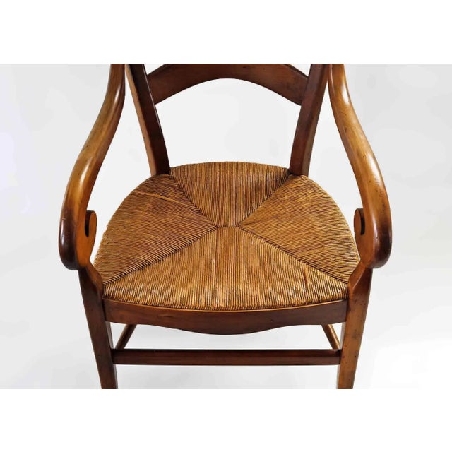 Pair of vintage French Provincial style ladder back armchairs. Rush seats are in very good condition, chairs are...
