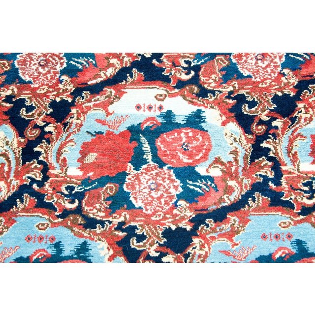 An incredible early 20th century Persian Senneh rug with the most beautiful large scale floral medallions each surrounded...