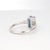 This stunning 14k white gold ring features a captivating octagon-cut aquamarine, weighing 1.54cts. The aquamarine displays...