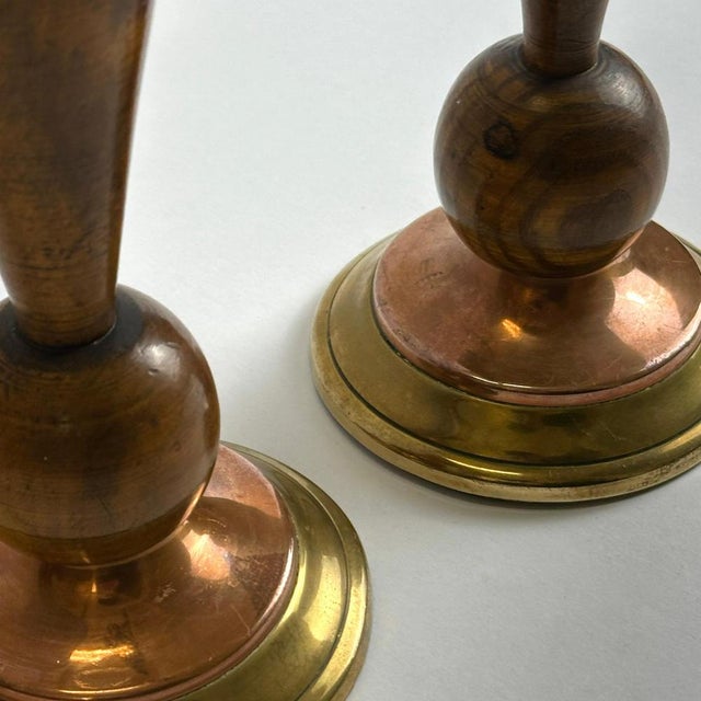 This pair of English Art Deco candlesticks, produced circa the 1930s, combines hand-turned hardwood stems with stepped...