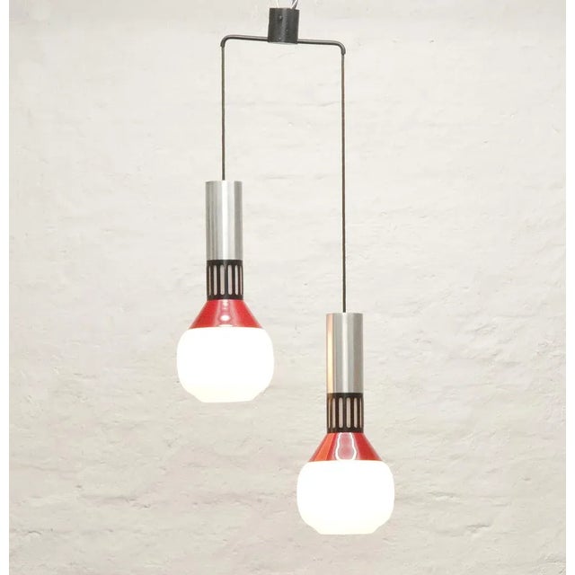 This model 1247 double ceiling light with frosted triplex opaline glass was produced by Stilnovo in the 1960s. Labeled by...
