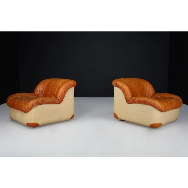 Mid-Century Modern Lounge Chairs by Guido Faleschini in Patinated Cognac Leather, Italy, 1960s Offered individually, these...