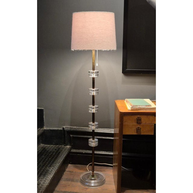 A swedish elegant floor lamp in brass and glass, model rd 1990, by carl fagerlund, scandinavian modern. Glass by reowned...