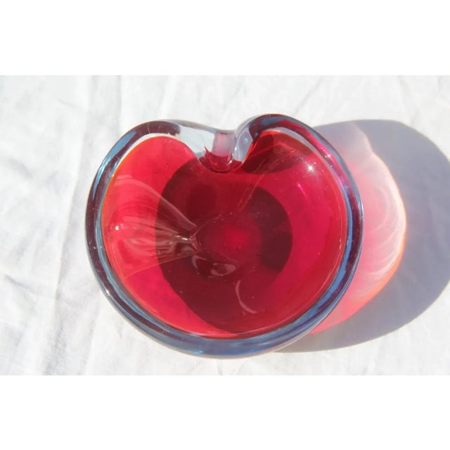 This ruby red bowl or ashtray was produced by Seguso in the 1960s.