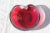 This ruby red bowl or ashtray was produced by Seguso in the 1960s.
