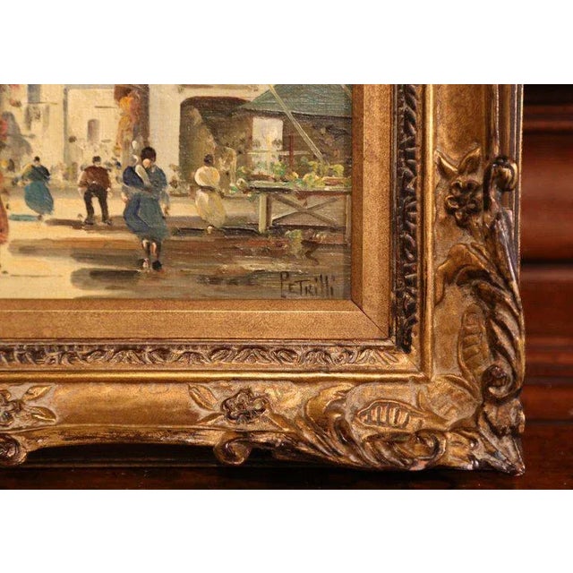 This oil on canvas painting was created in Italy, circa 1920. This painting depicts a European city street scene bustling...