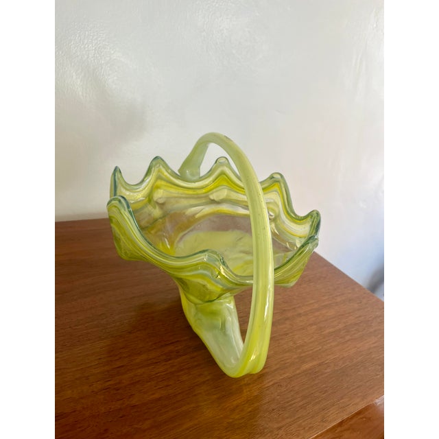 Unique piece of art glass by famed glass making hours Murano. The colors on this basket are as deep as they are beautiful....