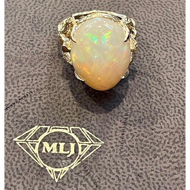 approximately 10 Carat Oval Shape Ethiopian Opal Cocktail Ring 14 Karat Yellow Gold size 5 Oval Natural Opal A classic,...