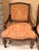 A matching pair of Bernhardt open armchairs with dark walnut-toned wood frames, rope-carved detailing, gracefully curved...