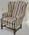 This is a really classic Chippendale-style wingback chair by Ethan Allen, a maker well known for producing high-quality...