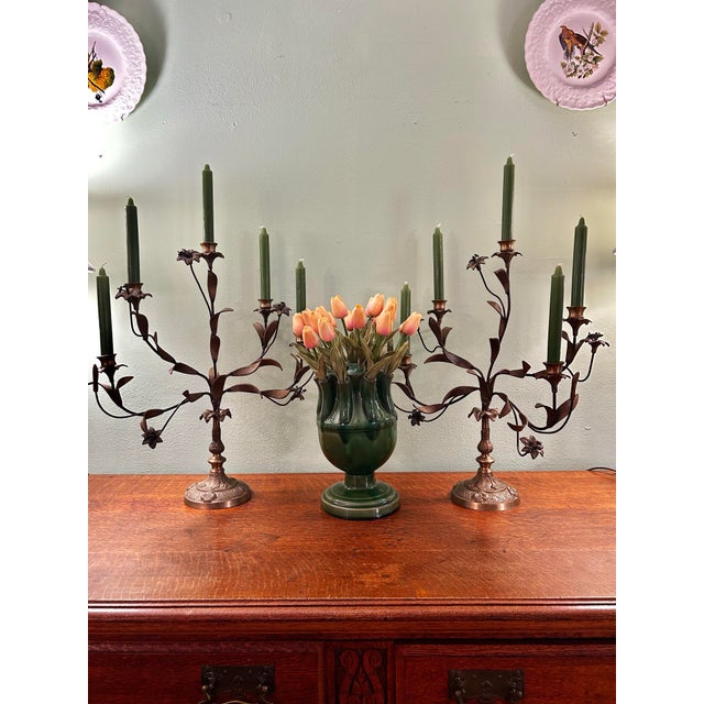 This is a pair of vintage five-light candelabra crafted from solid brass and retaining their original antiqued gilt...