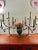 This is a pair of vintage five-light candelabra crafted from solid brass and retaining their original antiqued gilt...