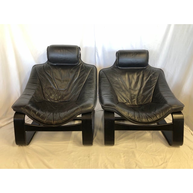 Pair of Kroken leather loungers in black. The wood frames are also black. The back is black canvas. They’re extremely...