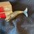 Articulated silver fish opener - with alabaster eyes. 8 segments plus it head and its tail. 8” long