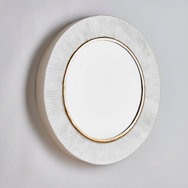 Generously scaled at over 40 inches, this mirror is a masterful wall accent. With a handcrafted enamel pearlescent finish,...
