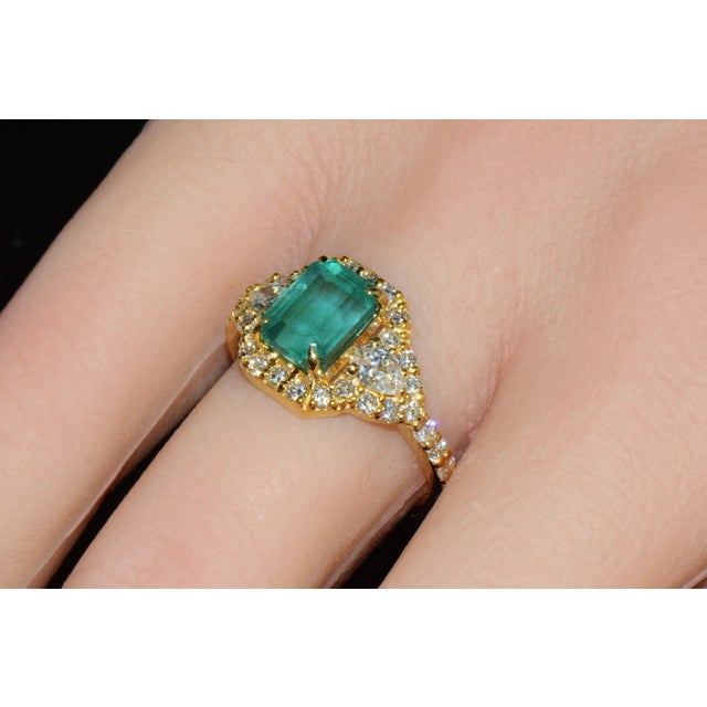 Certified natural 2.82CTS emerald and diamond solid 18K yellow gold ring. This elegant ring features a 1.91CT natural...
